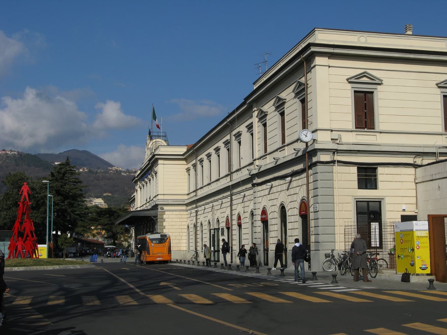 The street-side facade of La Spezia Centrale station, with its clock tower and entrance colonnade.