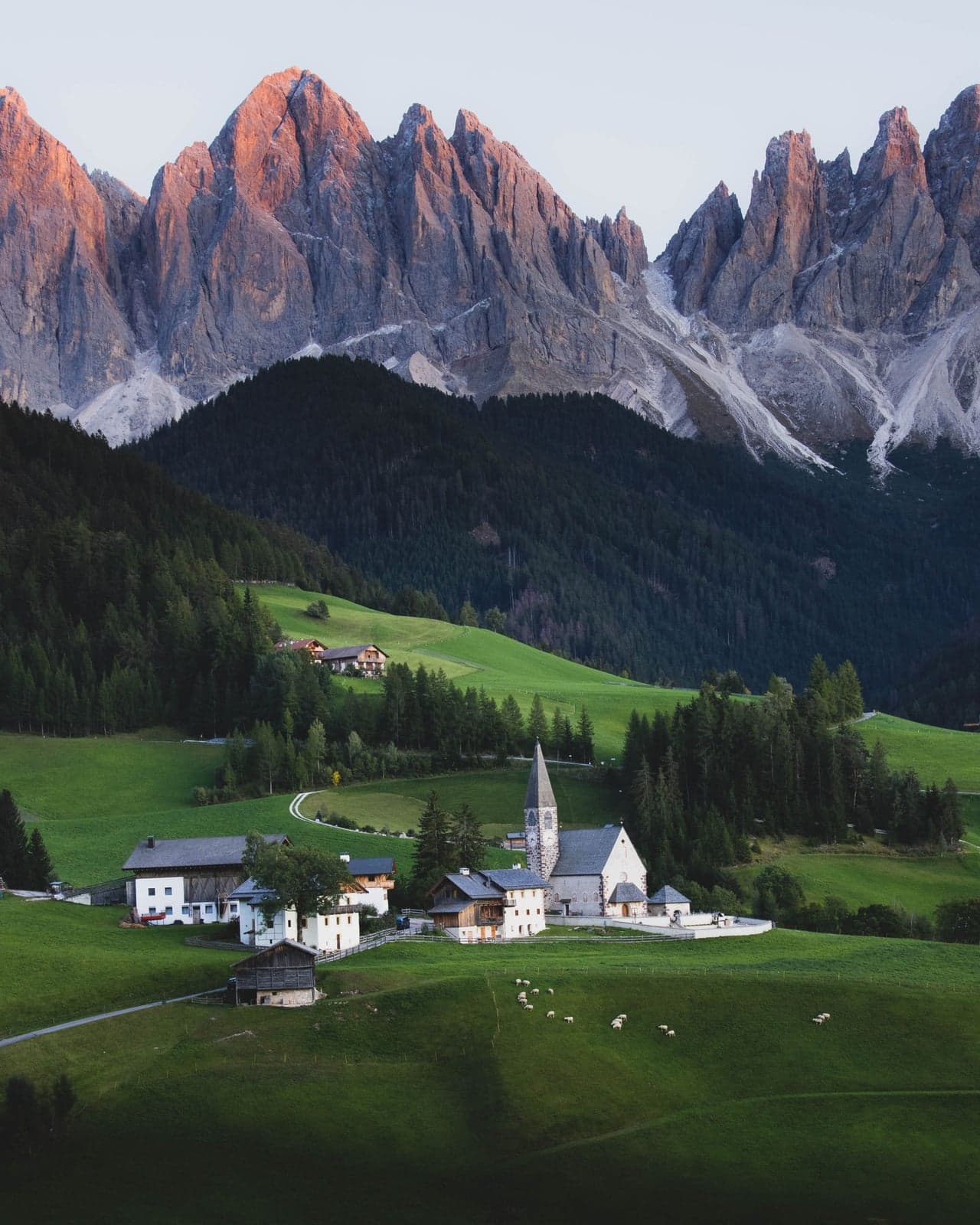 The church of Santa Maddalena on its rise with the full wall of the Odle behind it, seen from the Panoramaweg