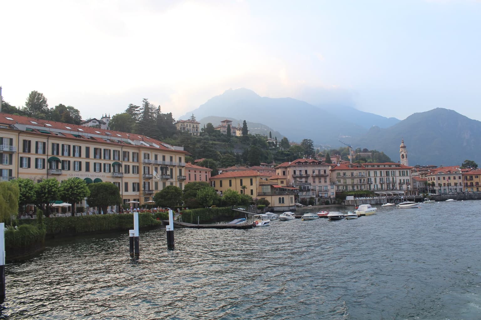 Menaggio's flat lakefront and Grand Hotel Menaggio, seen from the water with the hills rising behind