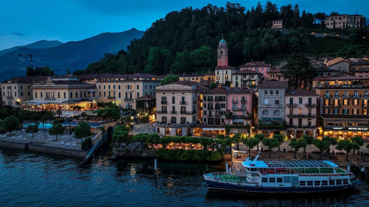Bellagio's waterfront glowing at blue hour after the day-trippers have gone, the version of the lake that rewards staying overnight