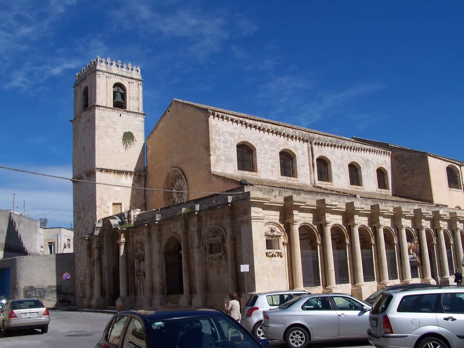The Basilica Santuario Santa Lucia al Sepolcro's plain façade on its own square, away from Piazza Duomo