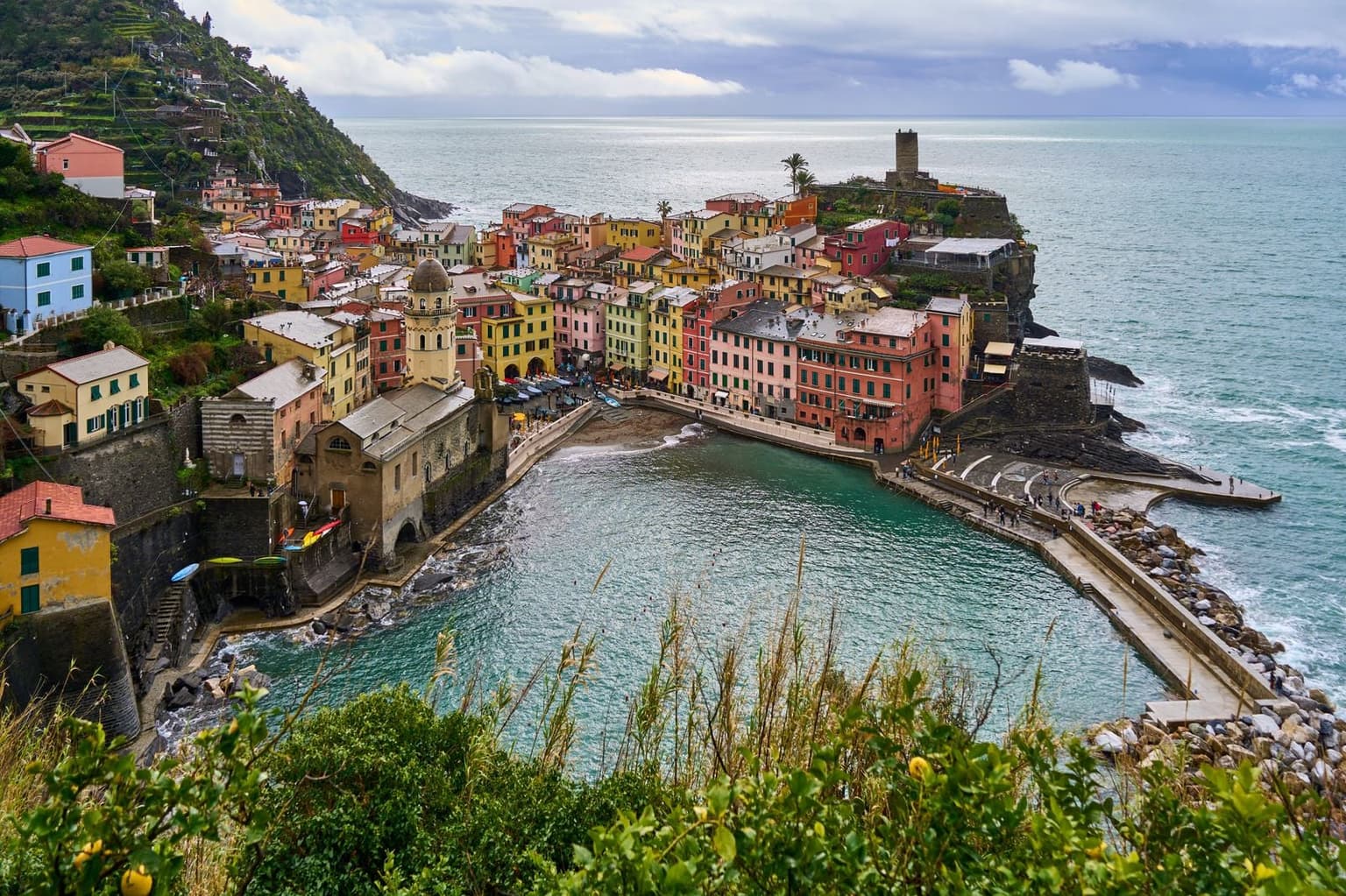 Vernazza's harbor and castle tower seen from the hillside above the village