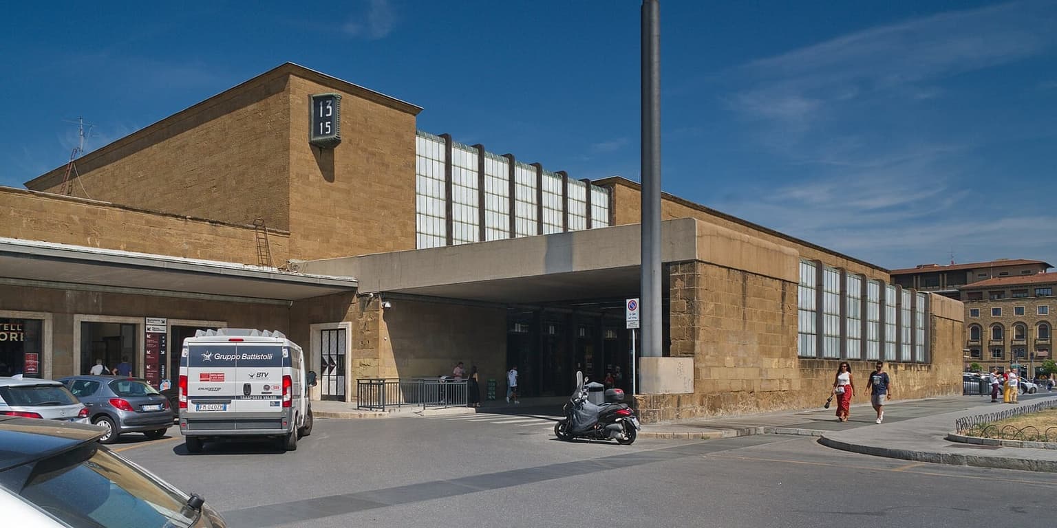 The Santa Maria Novella station building in Florence, a low sandstone block with a band of glass along the front