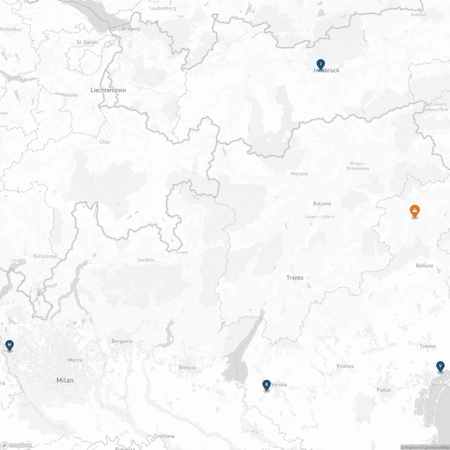 A labeled map of northeast Italy and western Austria showing Innsbruck, Milan, Verona, and Venice marked as airport-gateway pins around a central Dolomites location marker, illustrating the four routes into the mountains